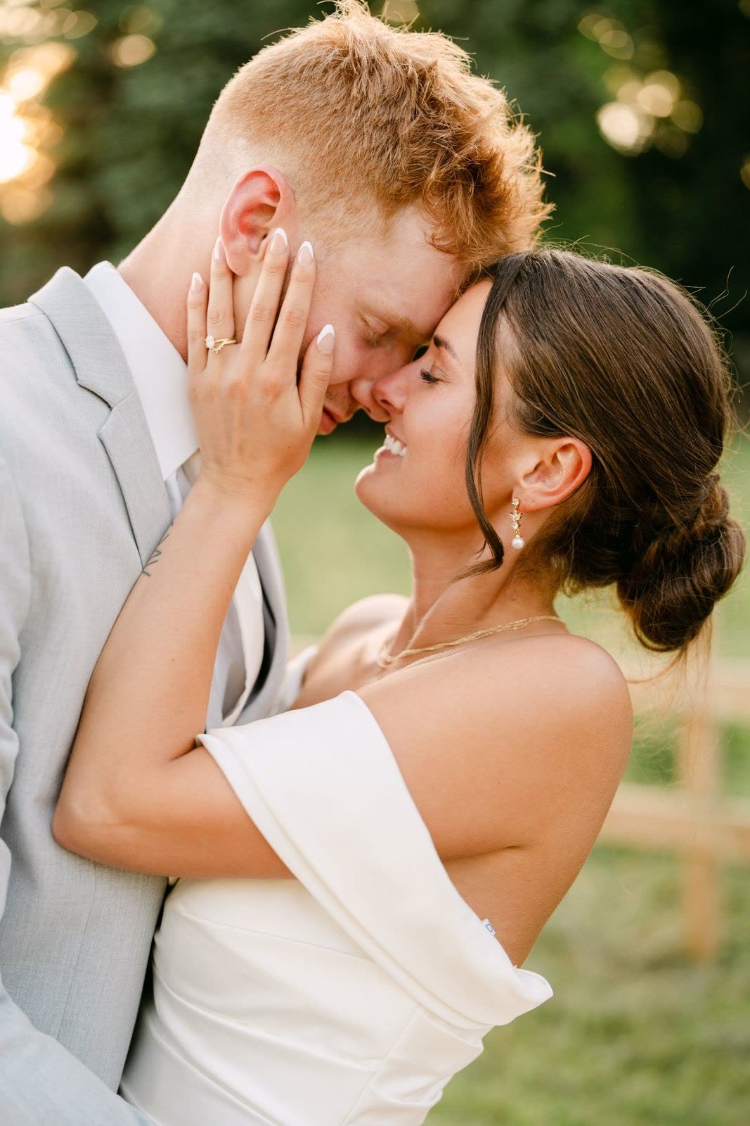 A couple holding each other in golden evening light
